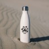 Gourde posée sur du sable
